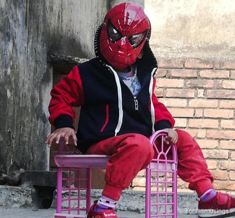 The boy as spiderman